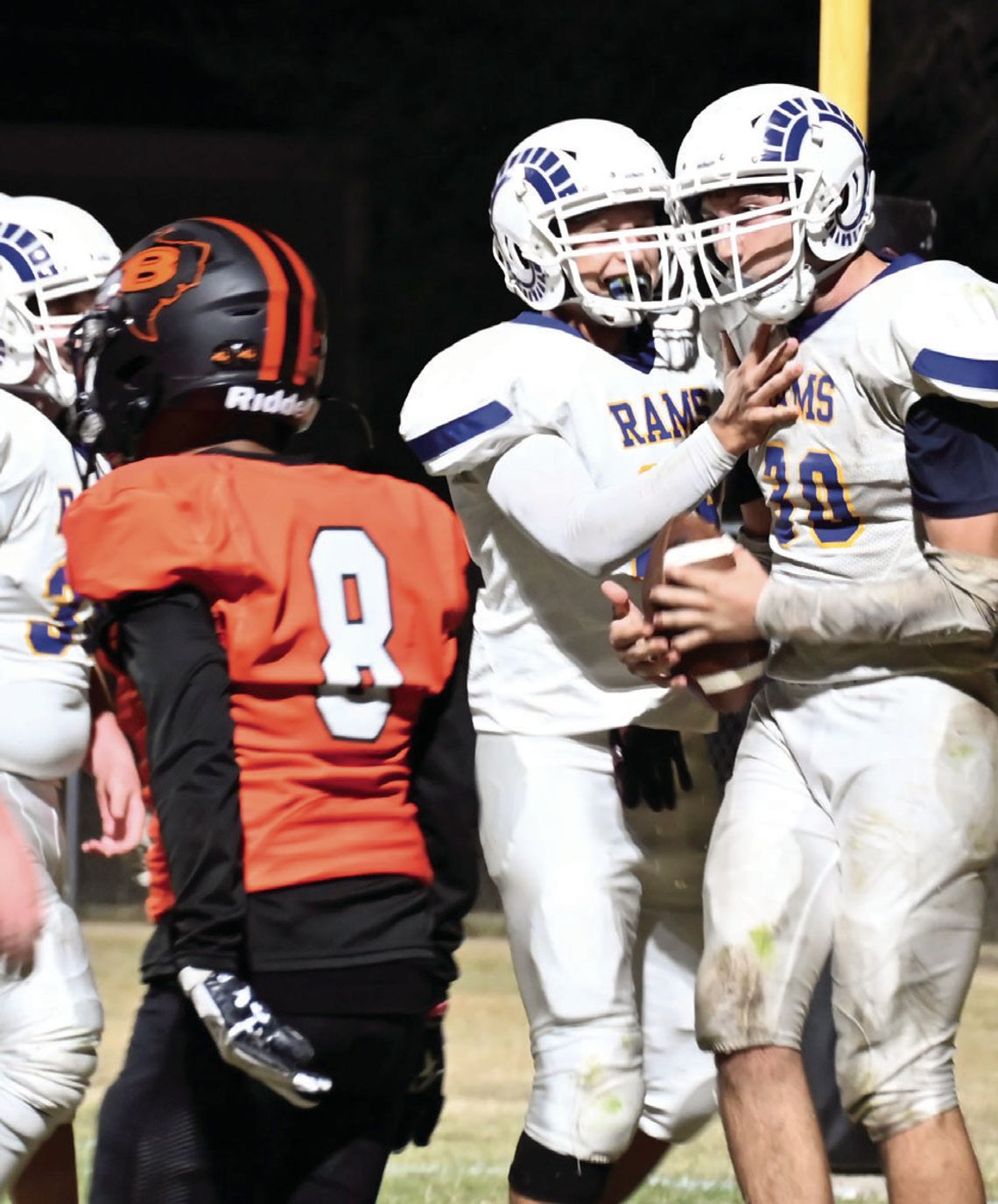 St. Mary’s Rams celebrate with senior Andrew Flores after scoring his first touchdown of the season.