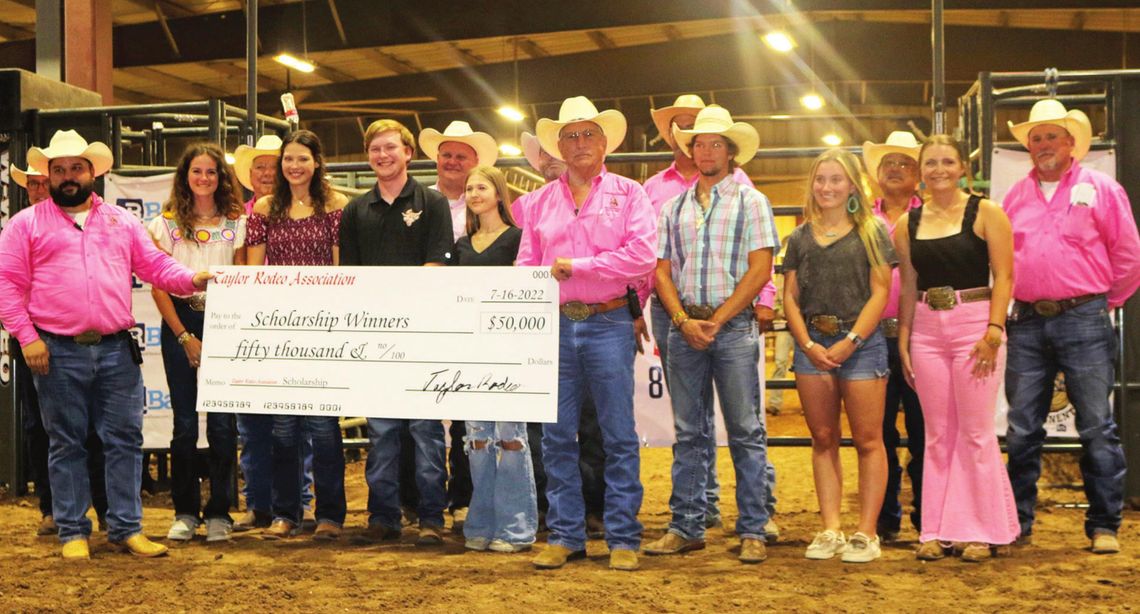 Texas Rodeo Association scholarship winners along with the TRA board members presenting the total check. Each of the ten recipients will receive $5,000 to cover tuition. Photos By Edie Zuvanic