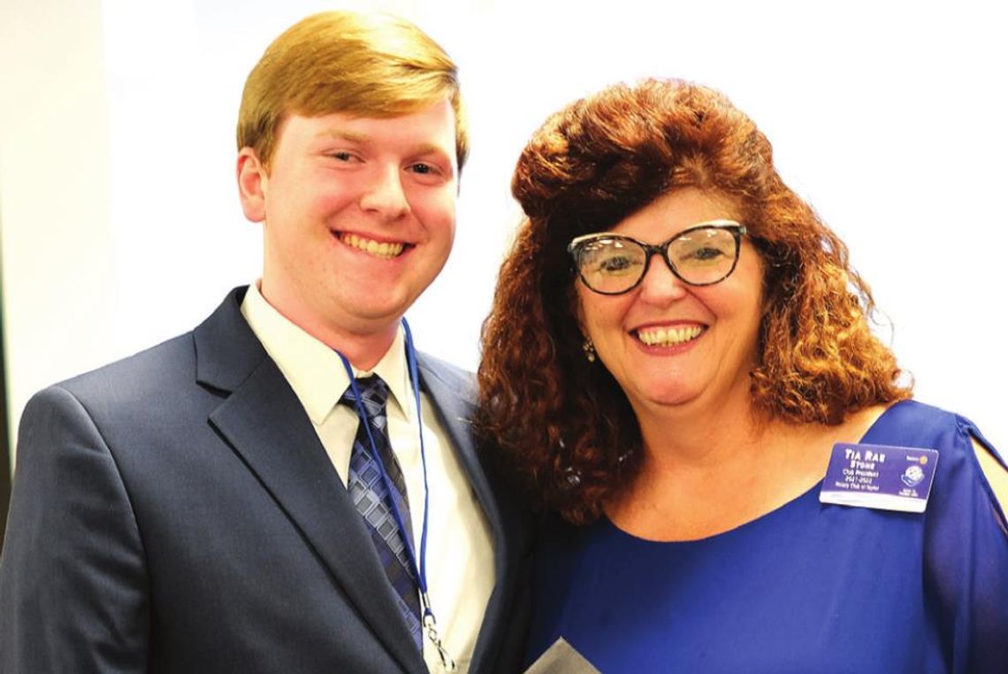 Rotary Club of Taylor president Tia Rae Stone presents the 2022 Bunnell-Rotary Academic Scholarship for $6,000 to Taylor High School graduating senior Trey Boles during a May 2 banquet in Taylor. Boles is the son of Renee Boles and Jarrell Boles. Photo by Richard Stone