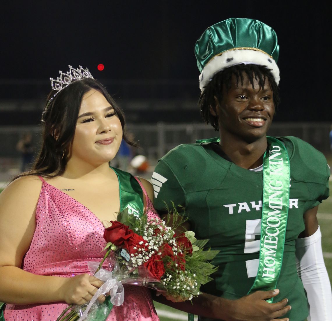 Annalise Frias and Jarvis Anderson are crowned the 2022 homecoming queen and king of Taylor Independent School District during halftime of the Taylor High School varsity football game against Jarell at the Duck Pond in Taylor Sept. 23 Photo by Jason Hennington