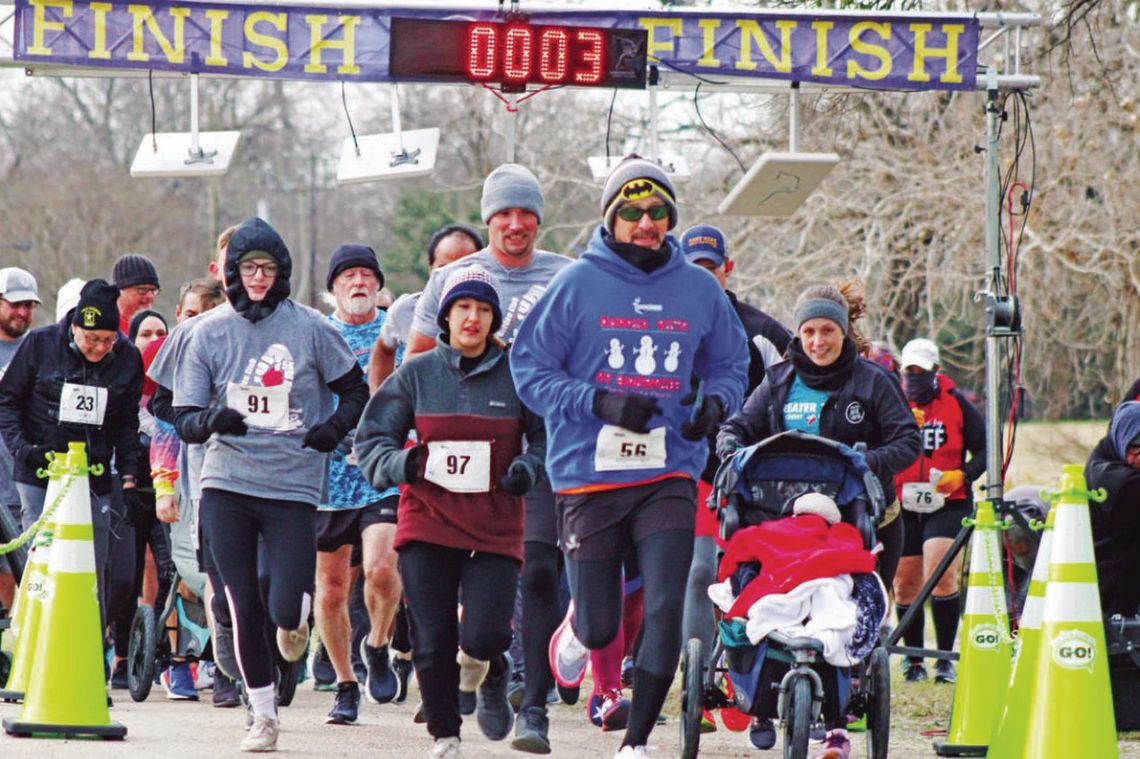 Runners take off into the chilly Saturday morning wind last year at the Taylor Garden Club Run for the Roses 5K/10K. Photo by Matt Hooks