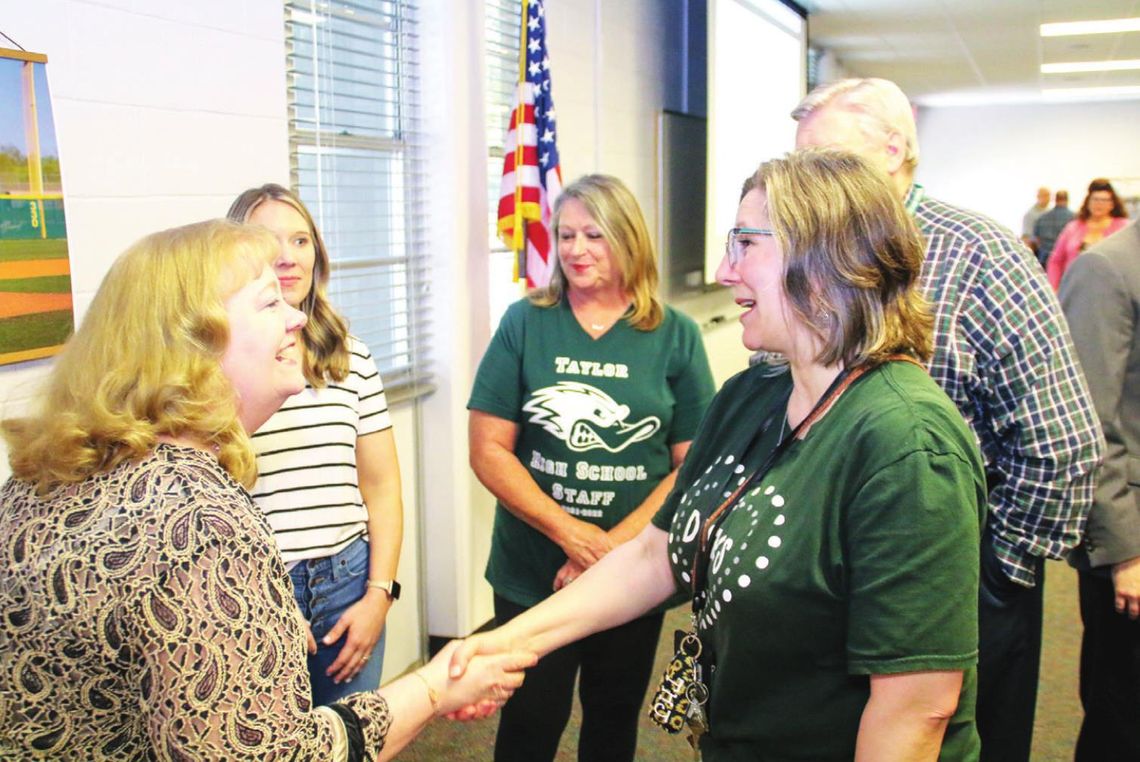 SAMSUNG GIFTS BOOKS TO TAYLOR ISD