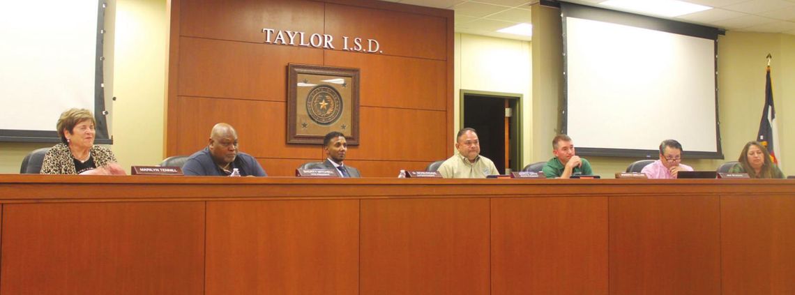 Marilyn Tennill, Shorty Mitchell, Superintendent Devin Padavil, board president Marco Ortiz, Joseph Meller, Jim Buzan and Cheryl Carter hear from residents during a public hearing during their Taylor ISD school board meeting in Taylor May 24. Photo by Fernando Castro