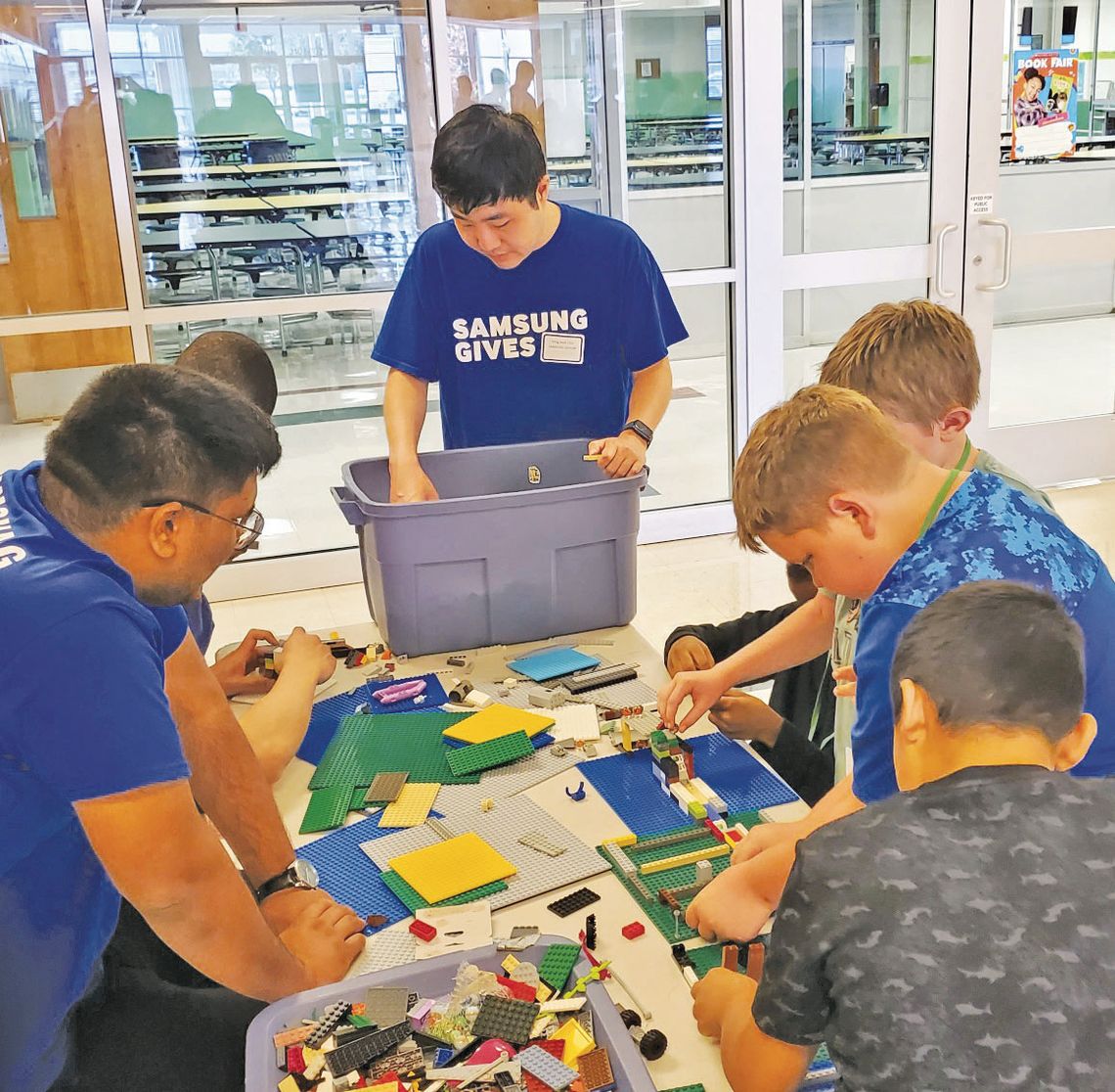 Samsung CORP volunteers with Main Street Intermediate School students. Courtesy photos Samsung Austin Semiconductor