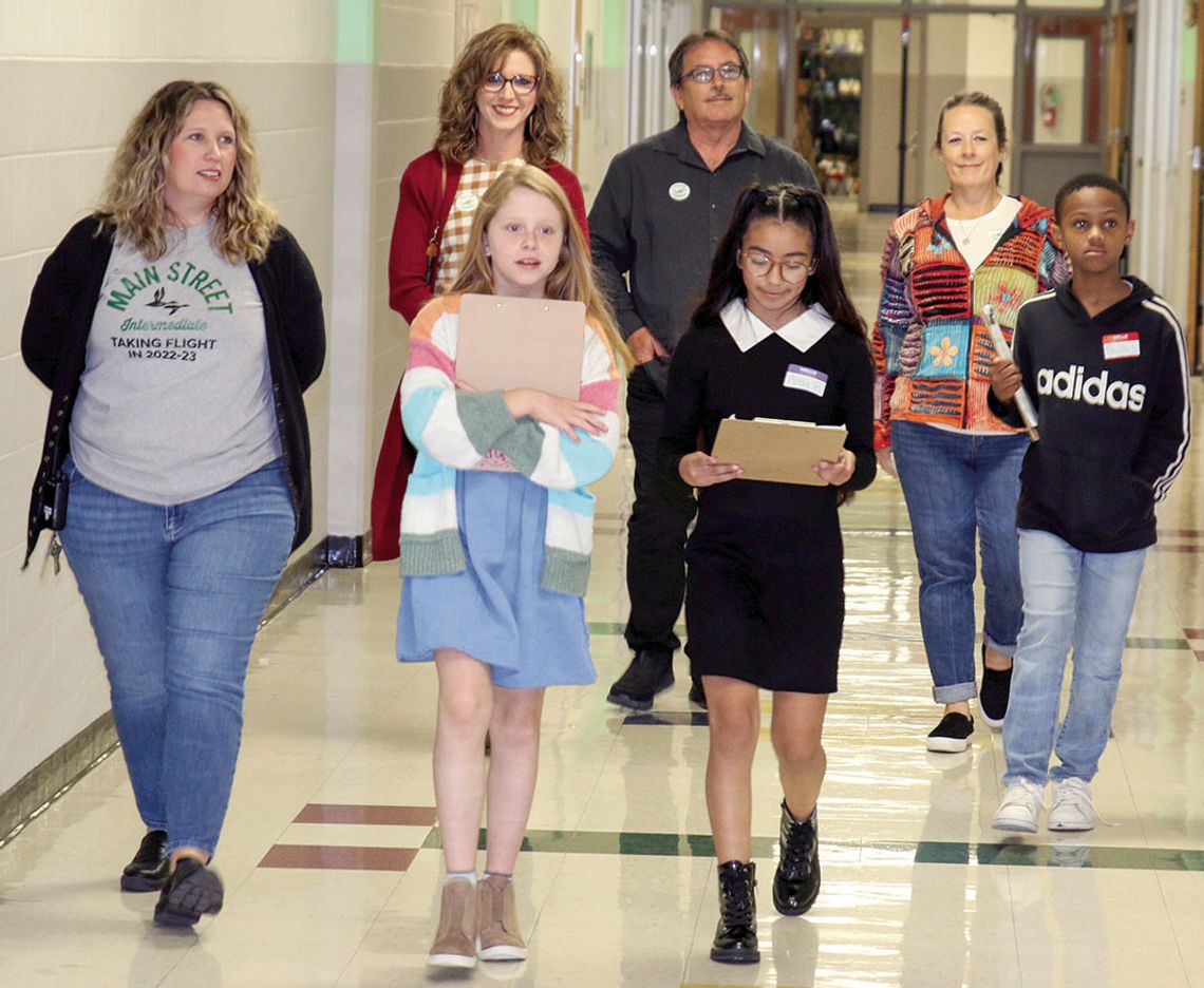 Student leaders host the Taylor ISD Ambassadors for a guided tour of their school. Students from left are Raegan Westerman, Amy Robles and Khalib Lewis. Adults from left are Principal Kerrie Pierce and Ambassadors Rachael Westerman, Tim Mikeska and Billie Logiudice.