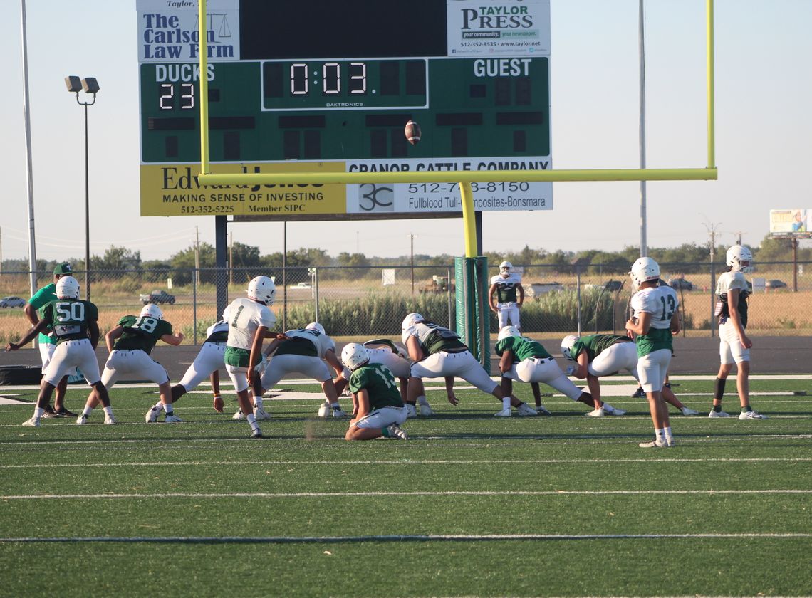 Taylor High School varsity football goes through a special teams drill with kicking extra points on Wednesday, Aug. 9 at the end of practice held at The Duck Pond. Photos by Andrew Salmi