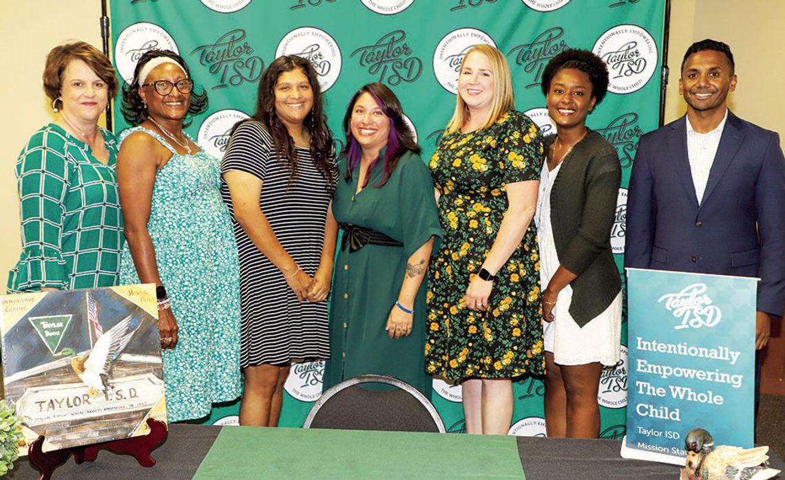 Taylor ISD Superintendent Devin Padavil and Assistant Superintendent Jennifer Patschke congratulate five of the six paraprofessionals elevating their careers to teaching positions for next school year. At the event were (from left), Patschke, Eliza Ackerman, Kylie Oglesby, Robyn Fernandez,...