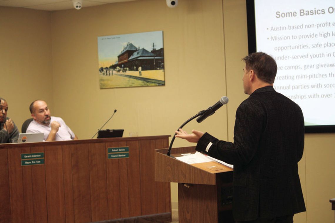 Aaron Rochlen, the founder and board chair of Soccer Assist, presents his organization’s plan to help install a mini pitch for individual and pickup soccer games at Murphy Park. Photo by Nicole Lessin