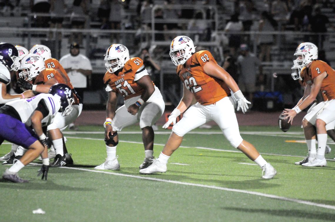 Hutto High School varsity football senior offensive guard Jamarion Whitley (51) and senior offensive tackle Preston Huneycutt (62) drop back into pass protection on Aug. 25 during the Hippos’ home game vs. San Marcos High School. Photo by Larry Pelchat 