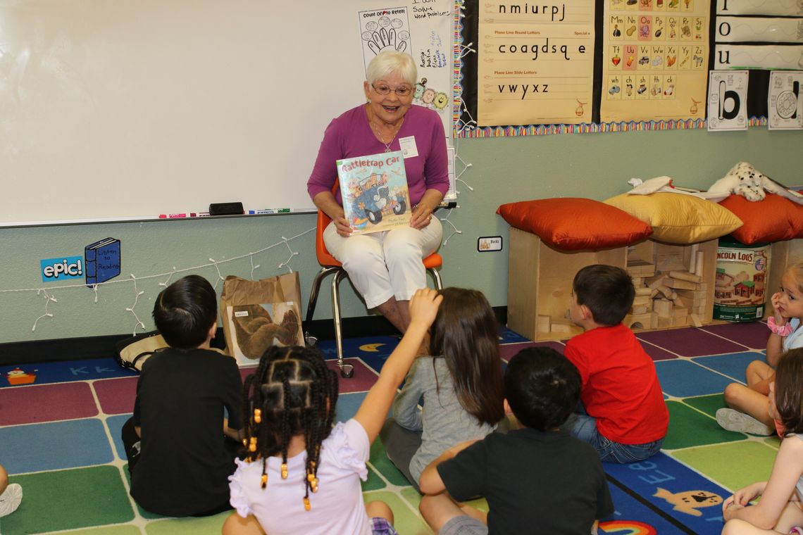 In memory of Naomi Pasemann, Darlene Rydell reads one of Pasemann’s favorite books, The Rattle Trap Car, to a kindergarten class at TH Johnson. Photos by Tim Crow