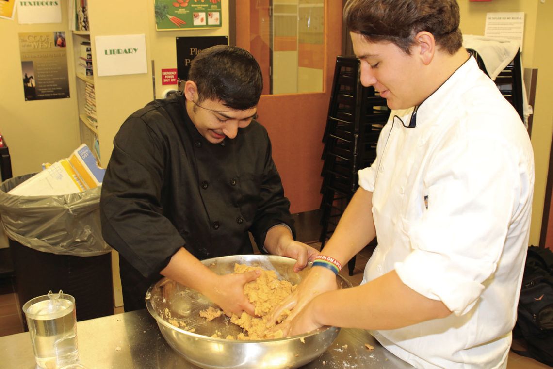 Culinary arts students prepare the masa for making tamales. photos by Photos by Tim Crow