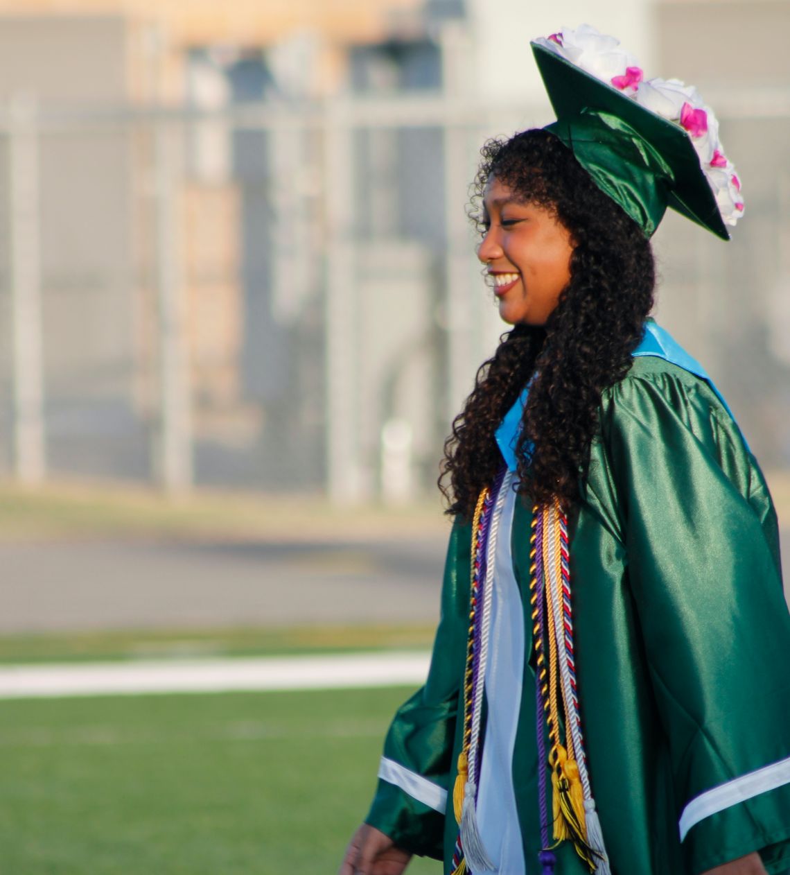 Samantha McIntyre walks at the field at Taylor Stadium in Taylor during high school commencement ceremonies May 27. Photo by Matt Hooks