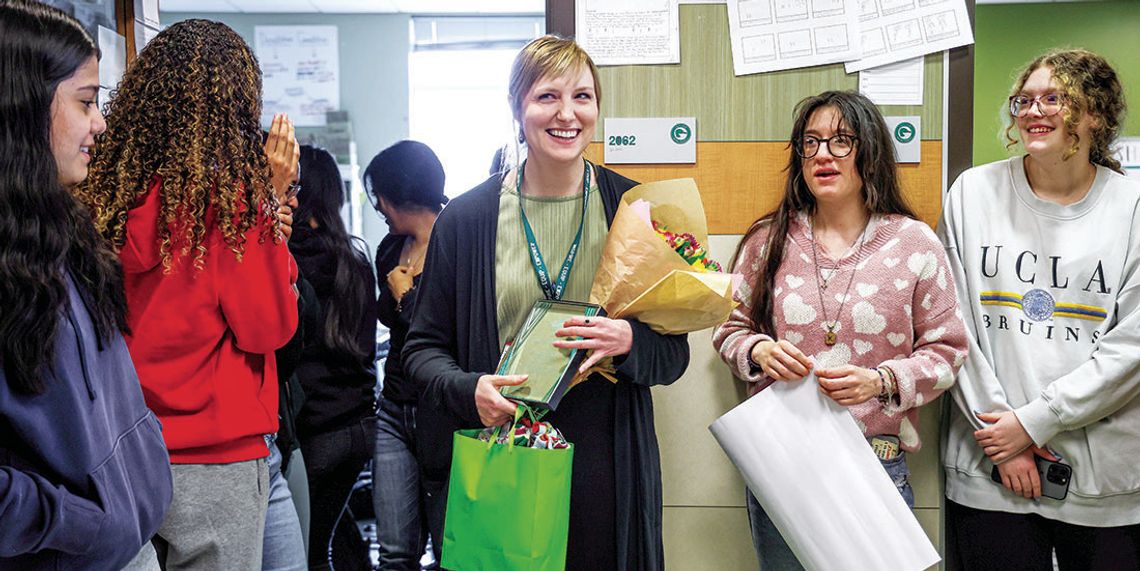 Taylor High School’s Teacher of the Year, Amber Nunnery, is congratulated by her students. Photo by Ryan Newsom