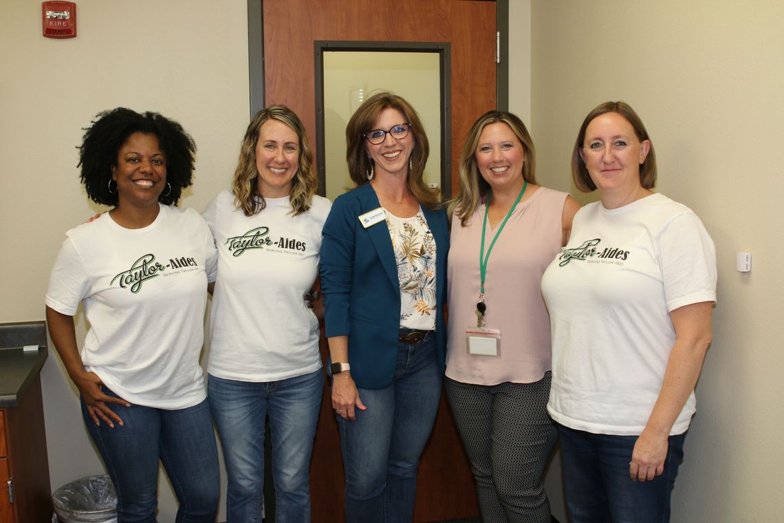 Taylor-Aides representatives visit with Main Street Intermediate Principal Kerri Pierce about volunteer opportunities for the 2022-23 school year. Volunteers are (from left) Stefanie Spells, Shauna Mullins, Rachael Westerman, Pierce and Susan Green. Photo by Tim Crow