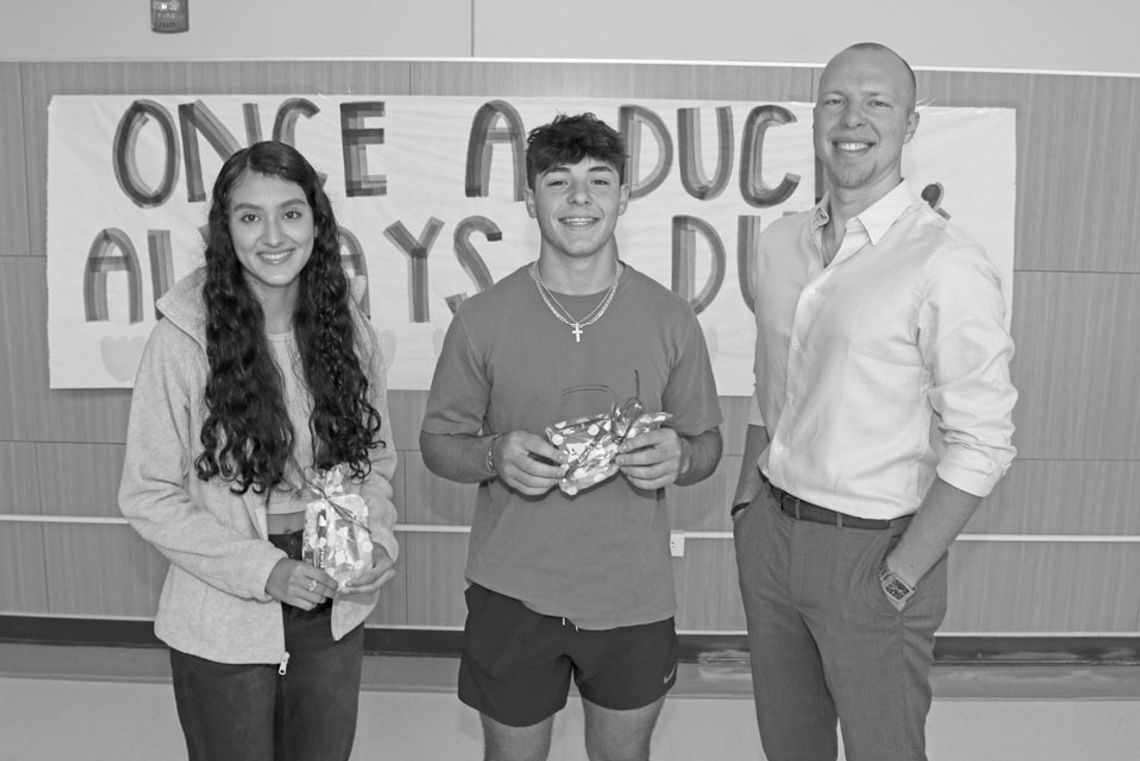 Ryan Schneider (Right), of RE/MAX Associates Group, congratulates Taylor High School Students of the Month, Estrella De La Torre (left) and Ryan Valdez (center). Photo by Tim Crow