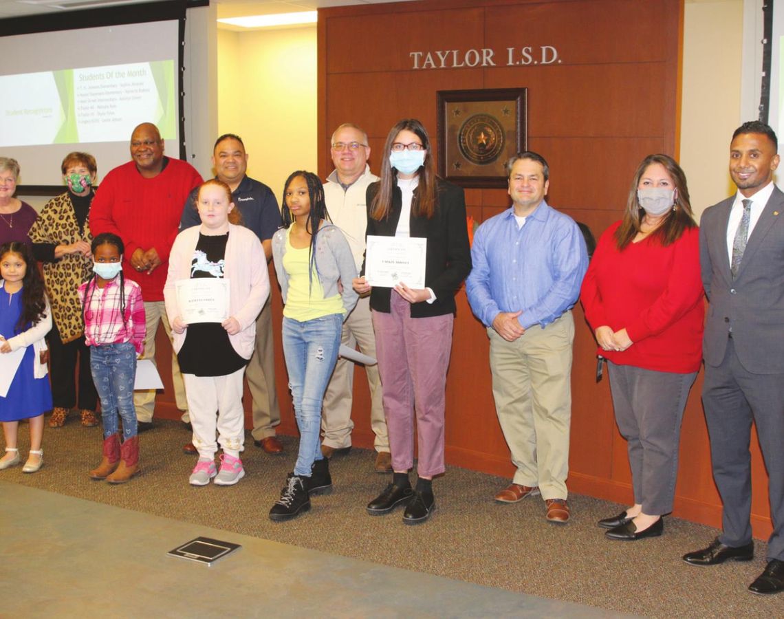 Taylor ISD school board members and Superintendent Padavil congratulate the students of the month for January. Honorees from left are Sophia Jimenez, Kambrie Blakely, Katelyn Green, Makayla Ross and Larkin Abbott. Not pictured is Skyler Pyles. Photo by Tim Crow