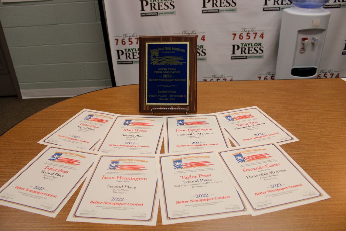 The Taylor Press studio is scattered with recognitions from the South Texas Press Association’s 2022 Better Newspaper Contest. Photo by Matt Hooks