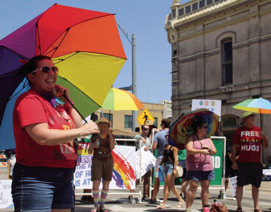 At last year’s Pride festival, Sheyenne Alverez enjoys the music while also serving as a member of the Parasol Patrol. Photo by Jason Hennington