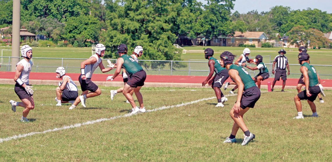 The Taylor High School varsity football defense surveys the field and looks to make a play against Lago Vista High School on June 10 during the 7-on-7 state qualifying tournament held at the track stadium in Cameron. Photos by Andrew Salmi