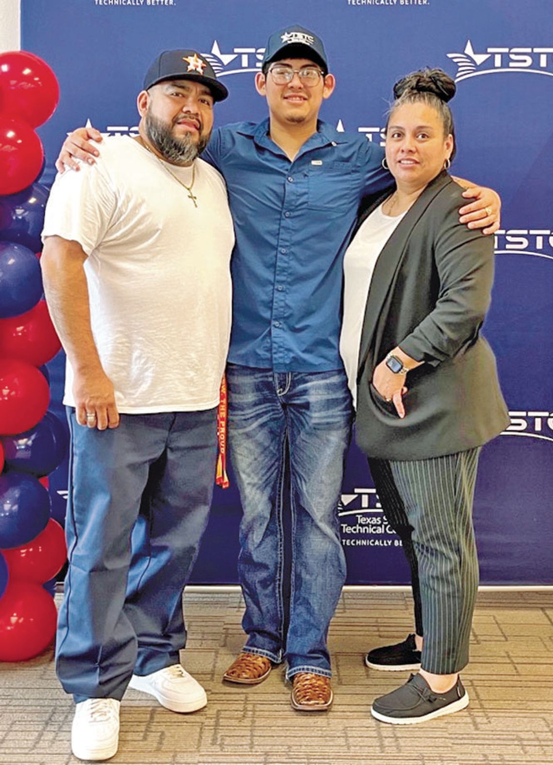 Taylor High School senior Johnathan Robles (middle) with mother Angie Roman-Robles (right) and uncle Joe Roman celebrates his intent to continue working towards an associate degree at TSTC. Photo courtesy of TSTC