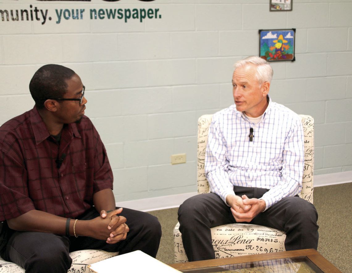 (From left) Area Editor Jason Hennington discusses new developments coming to the city with Assistant City Manager Tom Yantis May 8 at the Taylor Press’ studio. Photo by Nicole Lessin