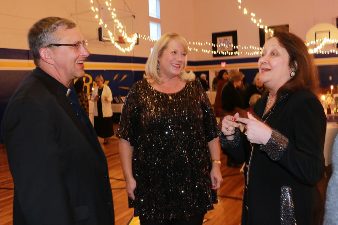 The Rev. Father Keith Koehl, Heidi Altman and Cecilia Abbott enjoy the Cultura Vitae event. Courtesy photo