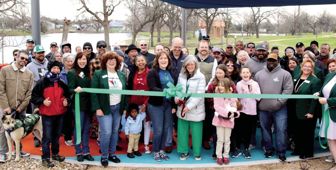 Above: Community members join together with members of Good Life for a ribbon cutting at Percussion Park Saturday morning.Below: Mayor Brandt Rydell (left) and City Manager Brian LaBorde join in on the fun of a performance by the Soulshine Rhythm Experience. Photos by Jason Hennington