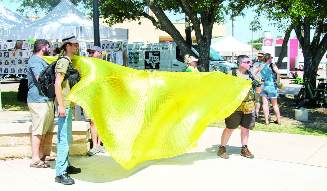 Veterans for Equality members block a protestor and sign in the middle of festival grounds. The organization visits events of the marginalized community to defend participants from protestors. Photos by Hunter Dworaczyk