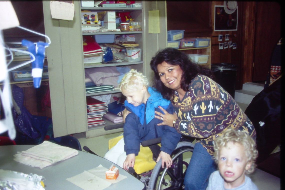 Bernice Sanchez assists students at Northside Elementary School during the early days of her career around 1996. Photo by Tim Crow