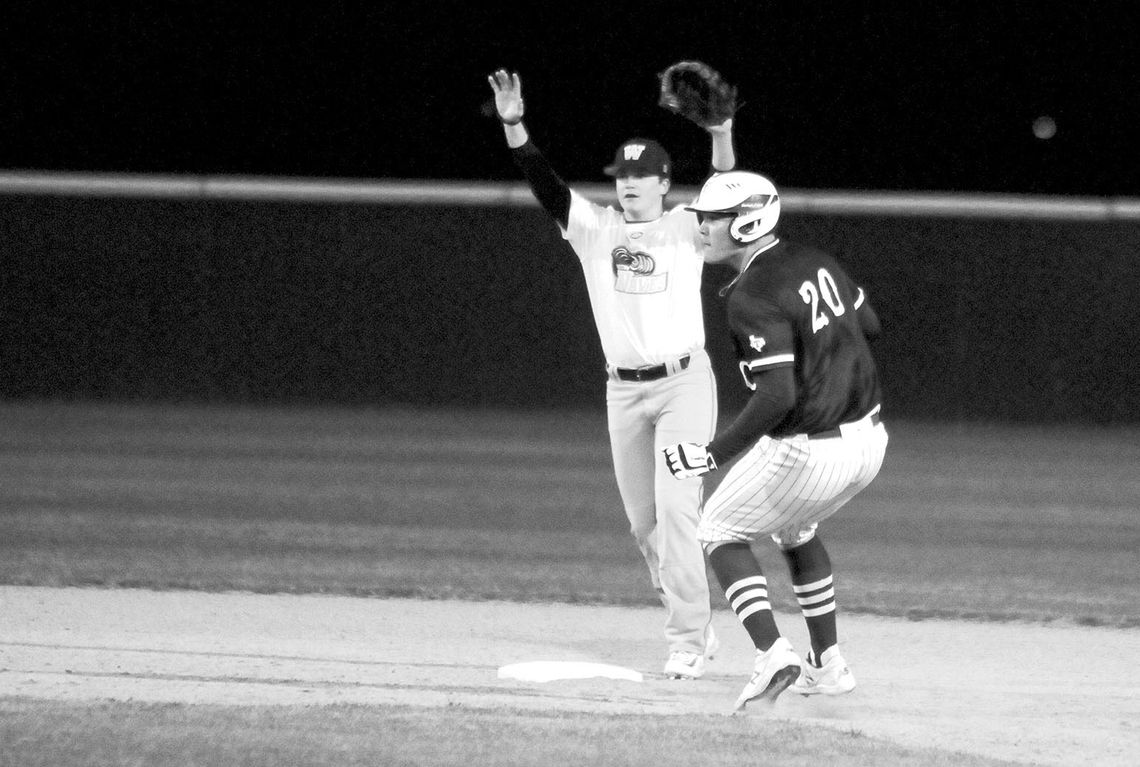 Tyler Bonkowski keeping his eyes on the catcher as he steals second base after a wild pitch. Photo by Larry Pelchat