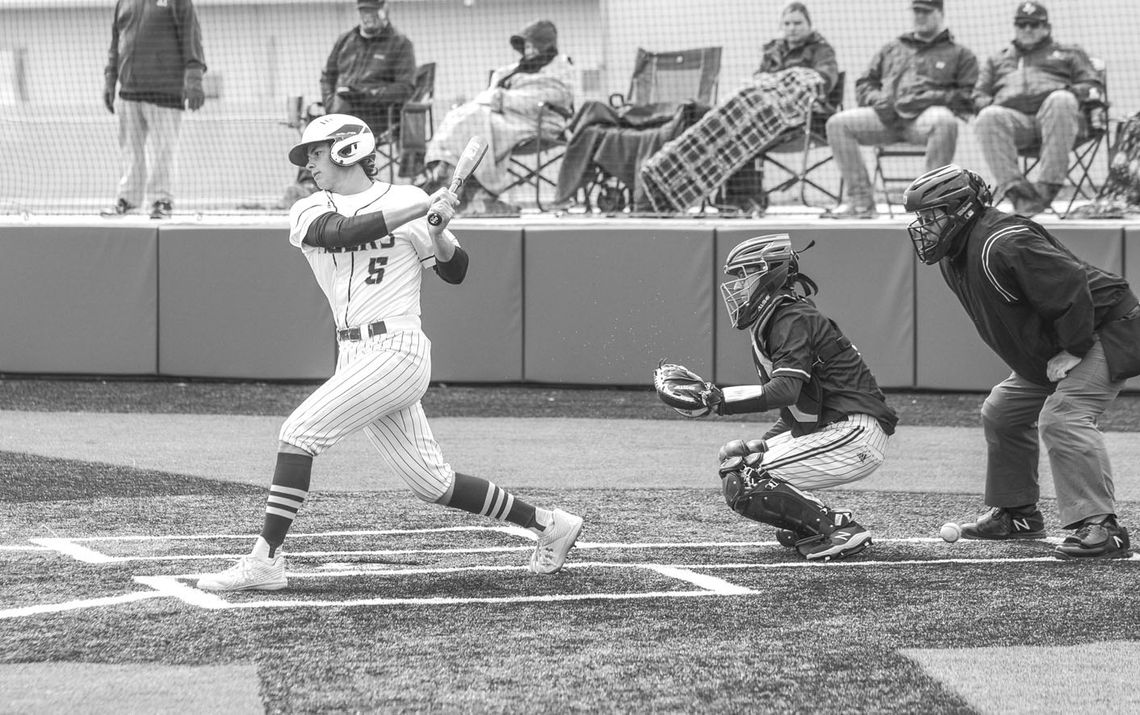 Bobby Clark swinging and fouling off a ball to stay alive in the batter’s box. Photo by Larry Pelchat