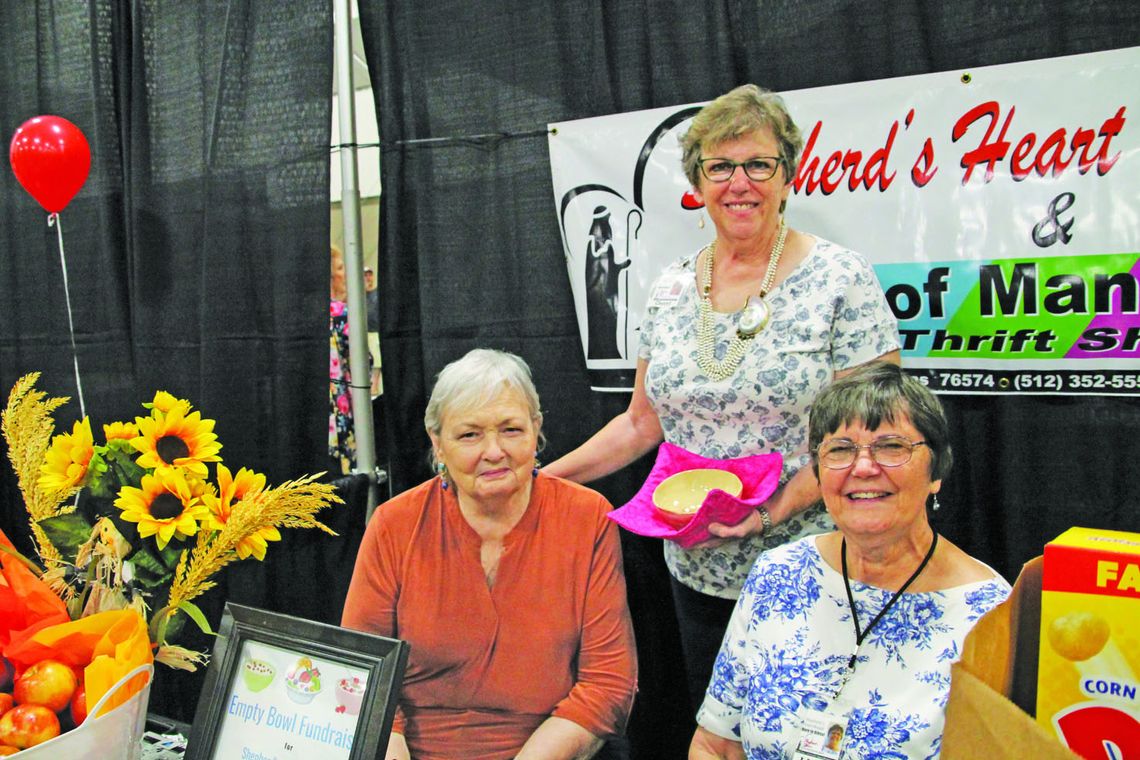 Shepherd’s Heart Taylor food pantry Executive Director Loretta Masters with Cheryl Cornelius, and Linda Flens at the Business Expo &amp; Job Fair Sept. 10. Photo by Nicole Lessin