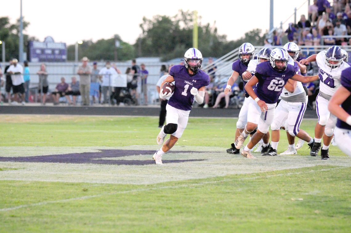 Thrall High School varsity football junior wide receiver Landon Gregory (1) runs with the ball on Sept. 8 during the Tigers’ dominant 49-0 victory at home vs. Florence High School. Photo by Larry Pelchat