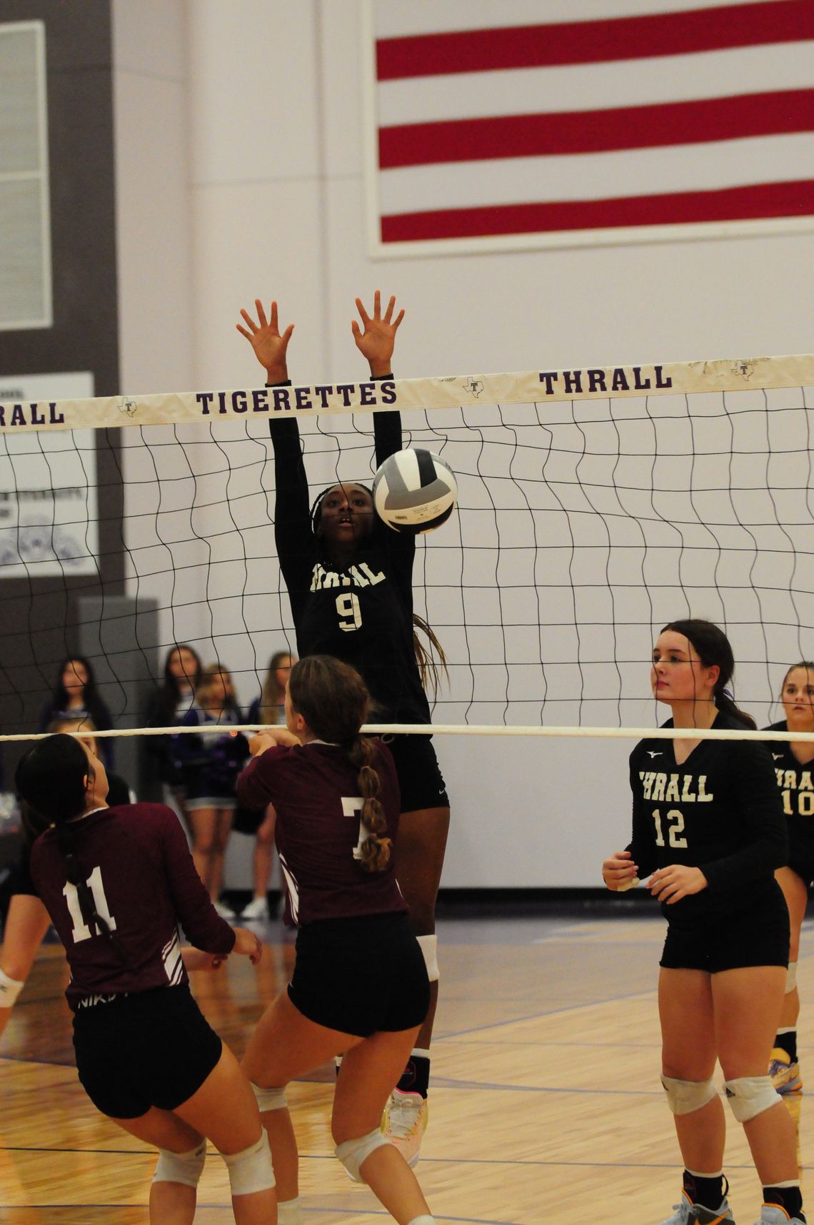 Tigerettes varsity volleyball sophomore Nevaeh Irvin blocks a shot at the net on Aug.22 during the Thrall match win against Troy.