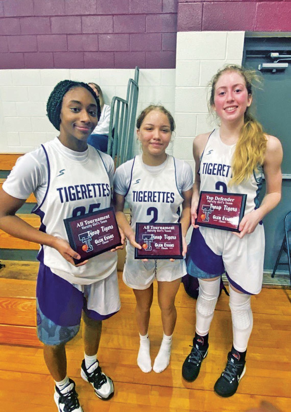 Freshman Nevaeh Irvin (left), freshman Brynn Leschber and sophomore Kassie Jackson posing with their awards after the tournament. Courtesy Photo