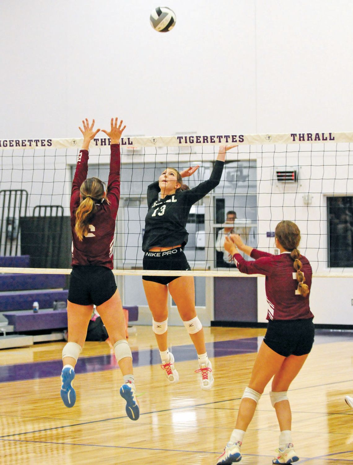 Thrall High School varsity volleyball freshman Ellie Schmidt goes up high to spike on Aug. 22 during the Tigerettes’ home match victory vs. Troy High School. Photos by Larry Pelchat