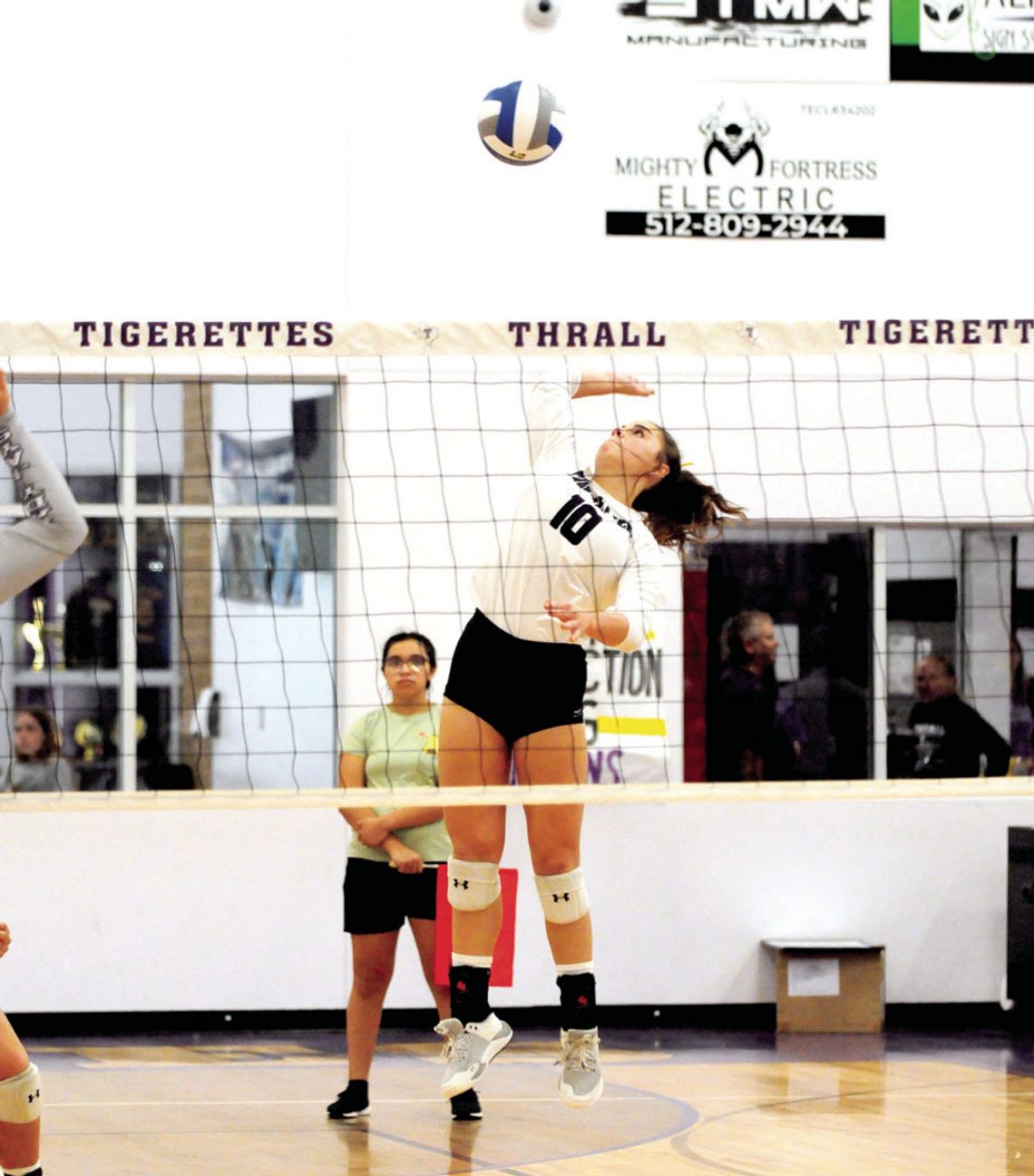 Tigerette’s junior Melaina Grissom spikes the ball during game against Holland. Photo by Larry Pelchat