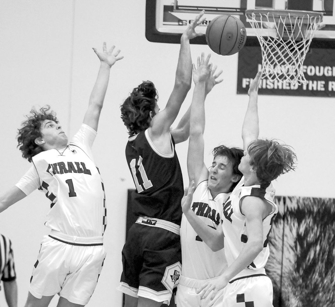 Tigers converge on a opposing player attempting to block a shot. Photo by Larry Pelchat