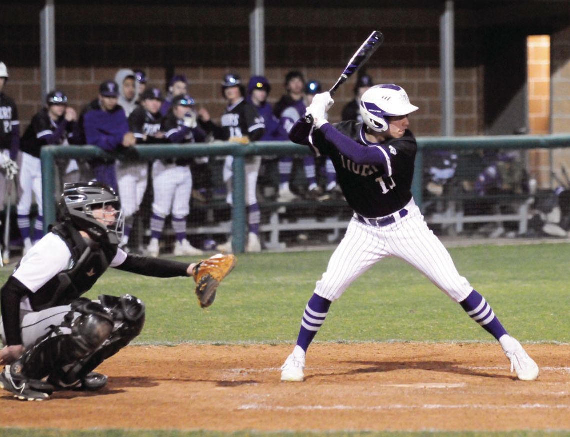 Jack Watson settling in to the batter’s box before making contact with the ball to get on base. Photo by Larry Pelchat