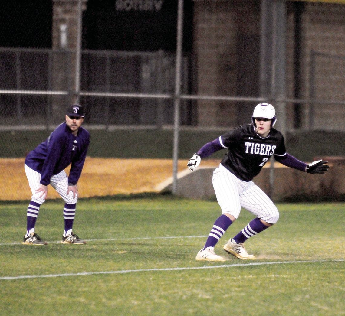 Tyler Bonkowski watching the catcher to see if he has an opportunity to steal home or not. Photos by Larry Pelchat