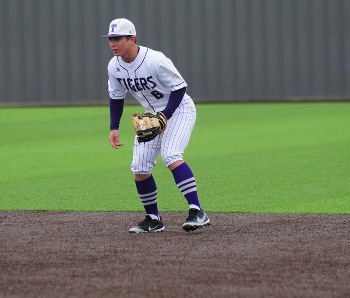 Anthony Sandoval getting low to the ground ready to field a ground ball. Photo by Evan Hale