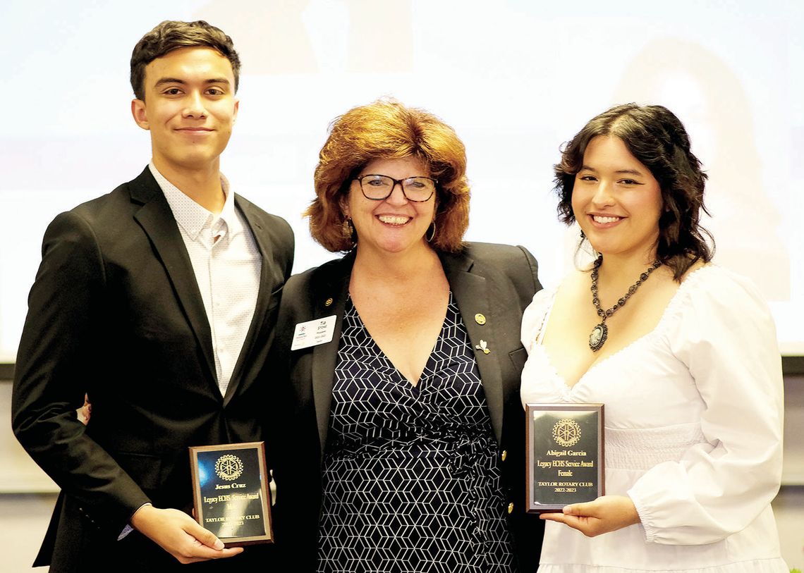 Taylor Rotary Club President Tia Stone (center) presents the Service Award to Jesus Cruz (left) and Abigail Garcia, seniors at Legacy Early College High School in Taylor at the May 1 Rotary Scholars Banquet. Courtesy photos