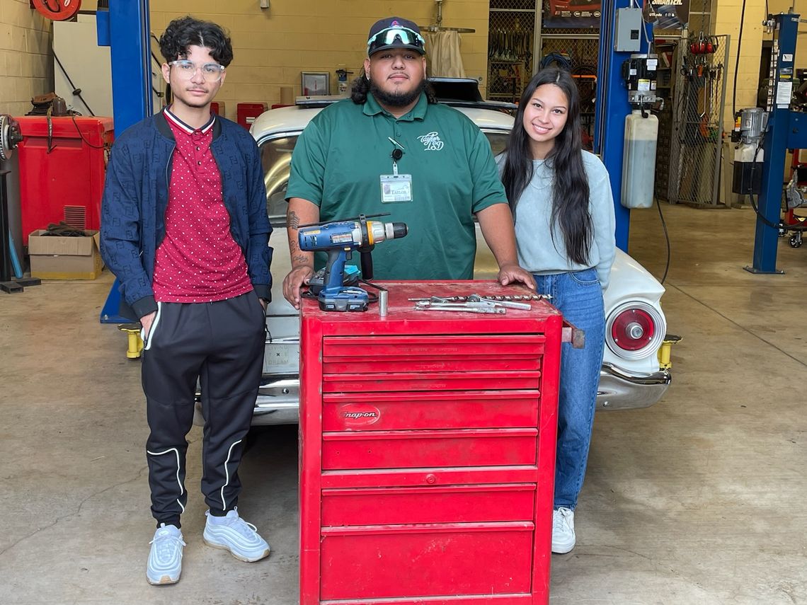 Taylor High School students Mustafa Alsabhawe and Melanie Quininez, and TISD staff member Jonathon Capetillo, accept the gift of a tool chest full of tools for the automotive department. The donation was made by Greg and Gennifer Tvrdik. Courtesy photo