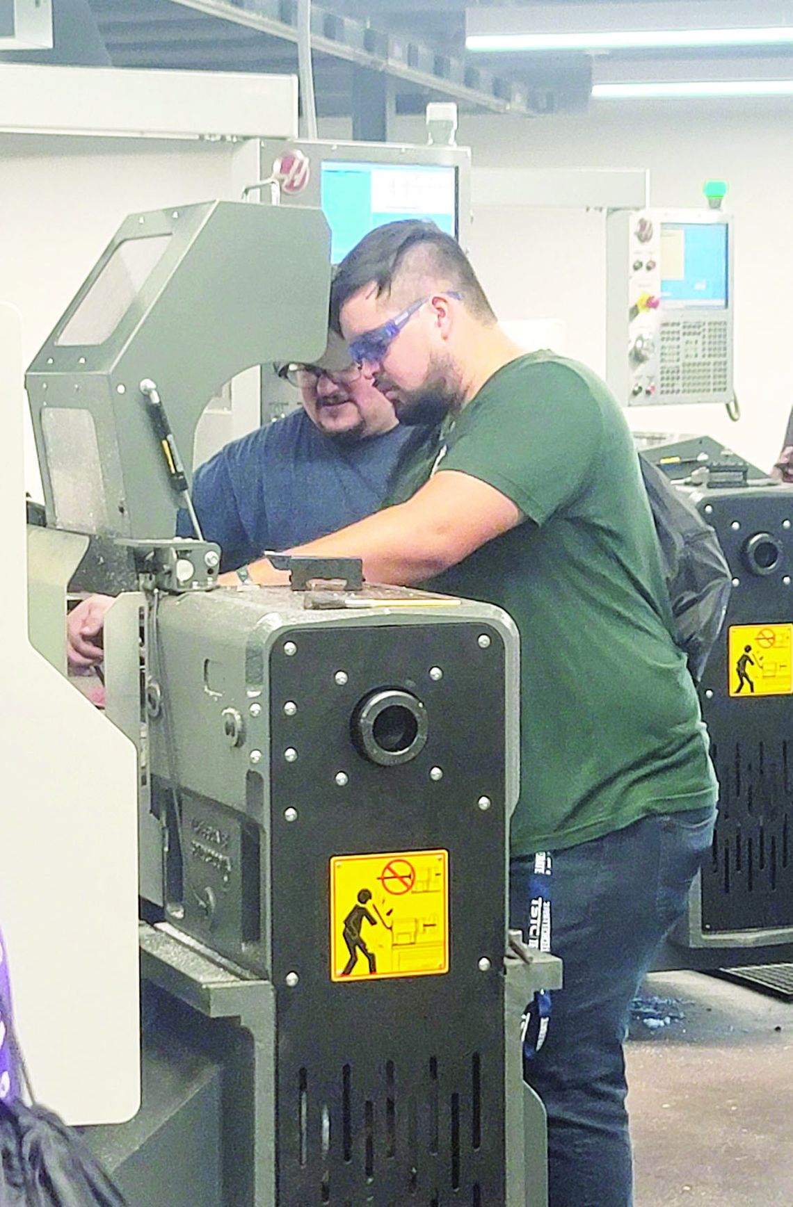 Zachary Gibson tries his hand at welding while learning more about technology classes offered to students.