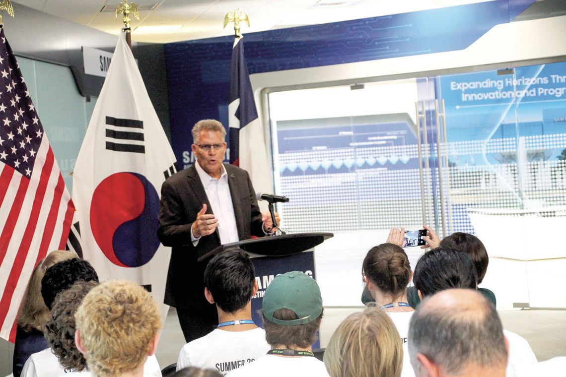 Williamson County Judge Bill Gravell speaks in front of Samsung Austin Semiconductor’s Taylor interns. Gravell was a driving force of ensuring the school district would gain an internship program for its students. Photos by Hunter Dworaczyk