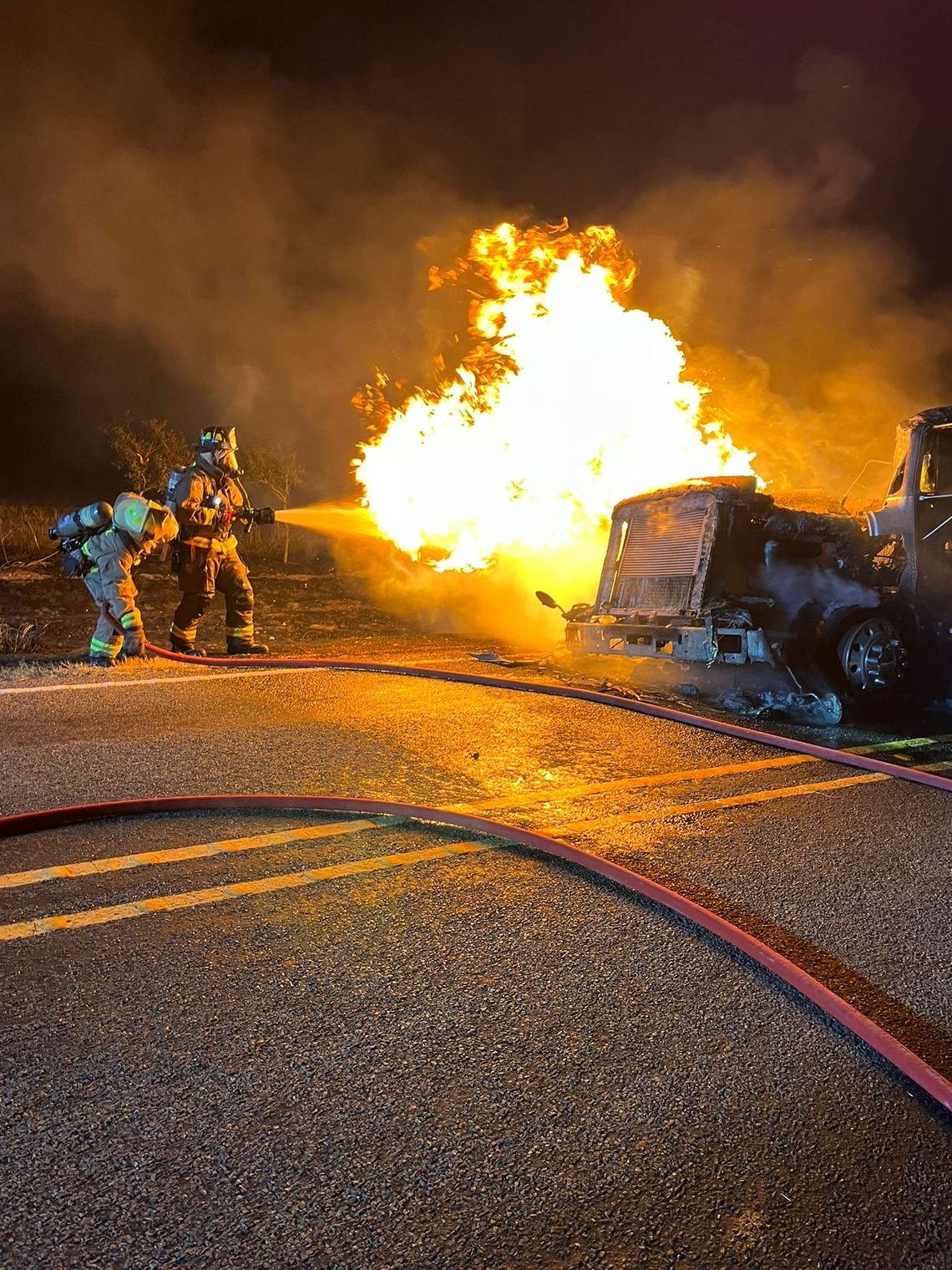 Two Williamson County Emergency Services District #10 firefighters battle a truck fire on FM 1331 in Hare Aug. 9. Facebook / Williamson County ESD #10