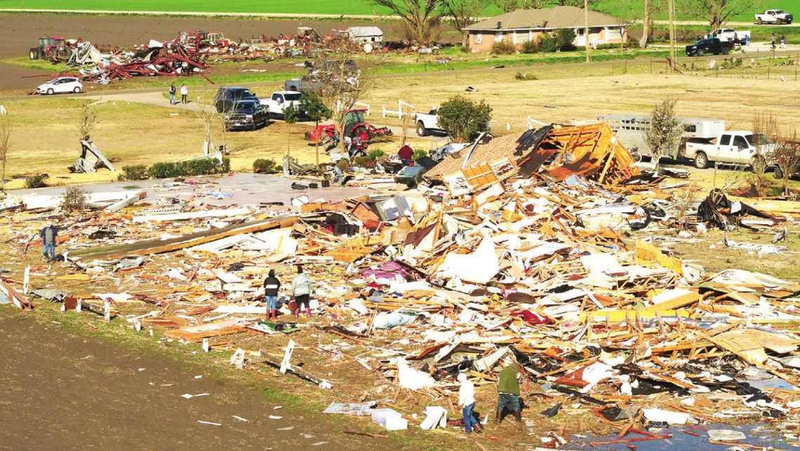 On Tuesday morning, Granger residents work to clean up and rebuild after the devastation from tornados Monday night. Photo by Jake Ferrigan, Aerotract Geospatial