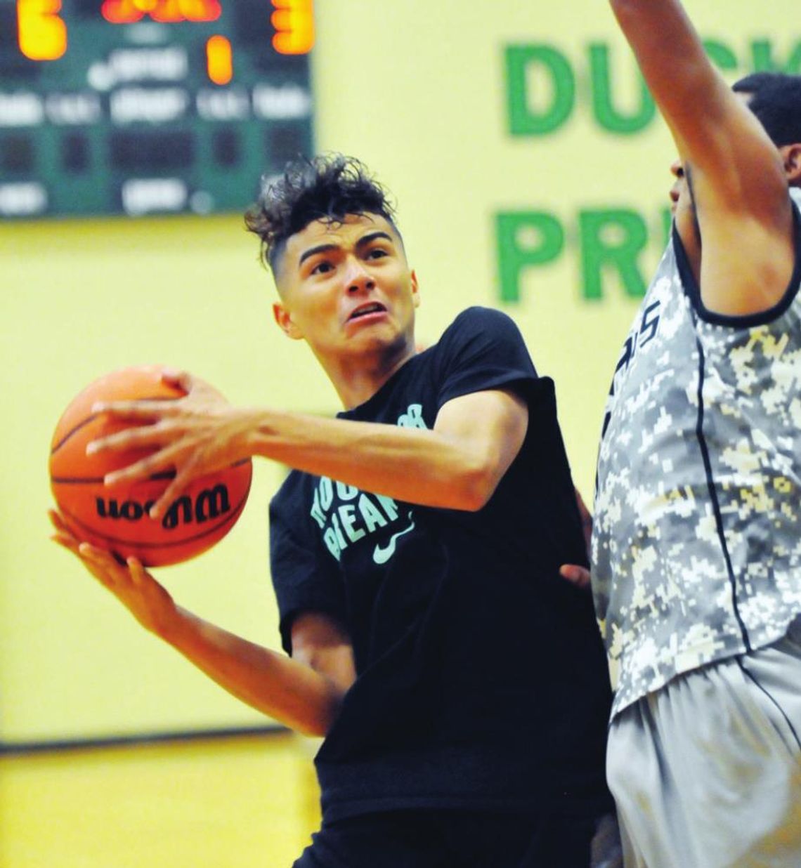 A player goes for a basket during a past Taylor Press 3-on-3 Basketball Tournament. The Tournament returns this weekend. Photo by Larry Pelchat