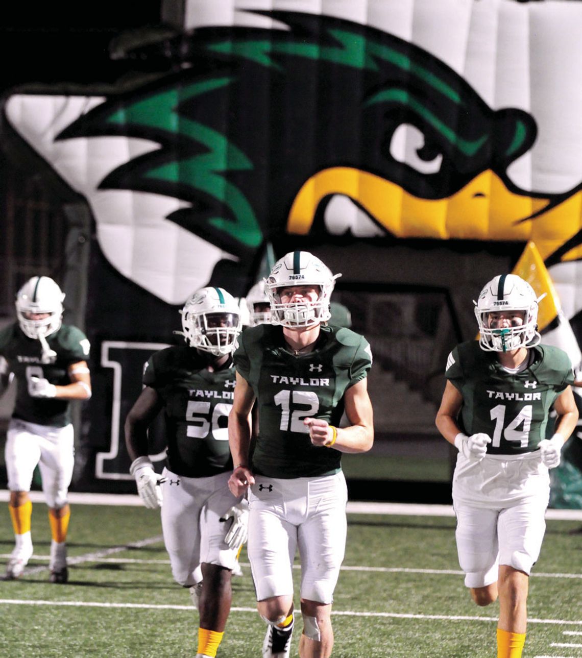 The Taylor Ducks run out of the tunnel for the second half against Robinson.v