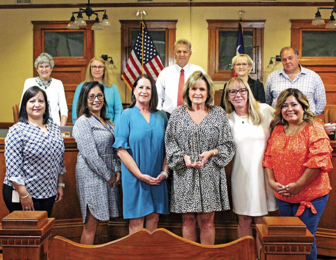 Top row from left to right: Commissioner Terry Cook, Commissioner Cynthia Long, County Judge Bill Gravell, Commissioner Valerie Covey, Commissioner Russ Boles. Bottom row from left to right: Deanna Saucedo, Lisa Bell, Cathy Mendoza, Lisa David, Alison Gleason, Alvina Galvan.